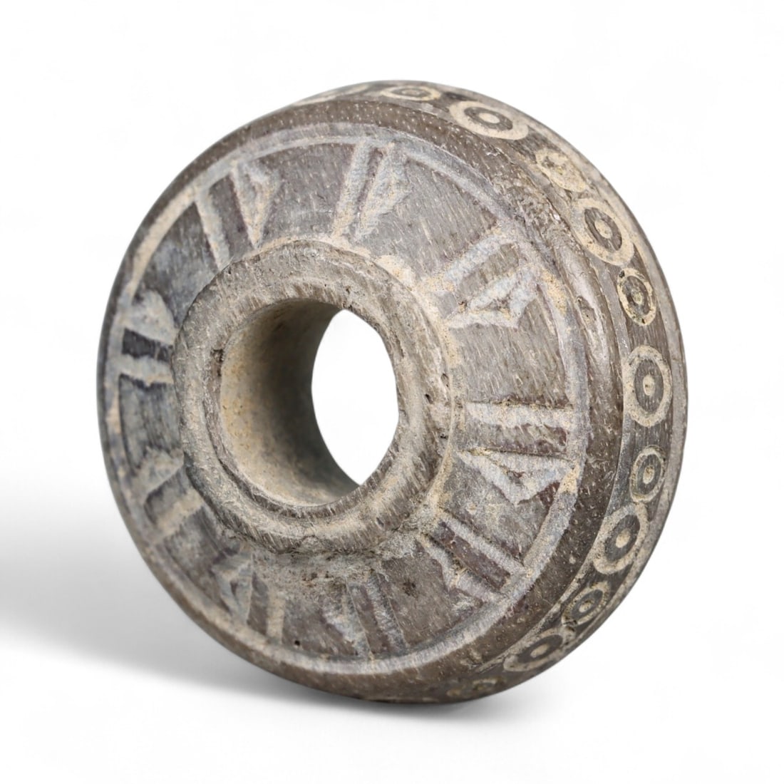 Ancient Medieval Nishapur Silk Road Bone Spindle Whorl, c. 9th-11th Century CE, 1.8cm: This finely carved spindle whorl originates from Nishapur, an important Silk Road city in medieval northeastern Iran, dating to approximately the 9th-11th century CE. Such spindle whorls were essentia