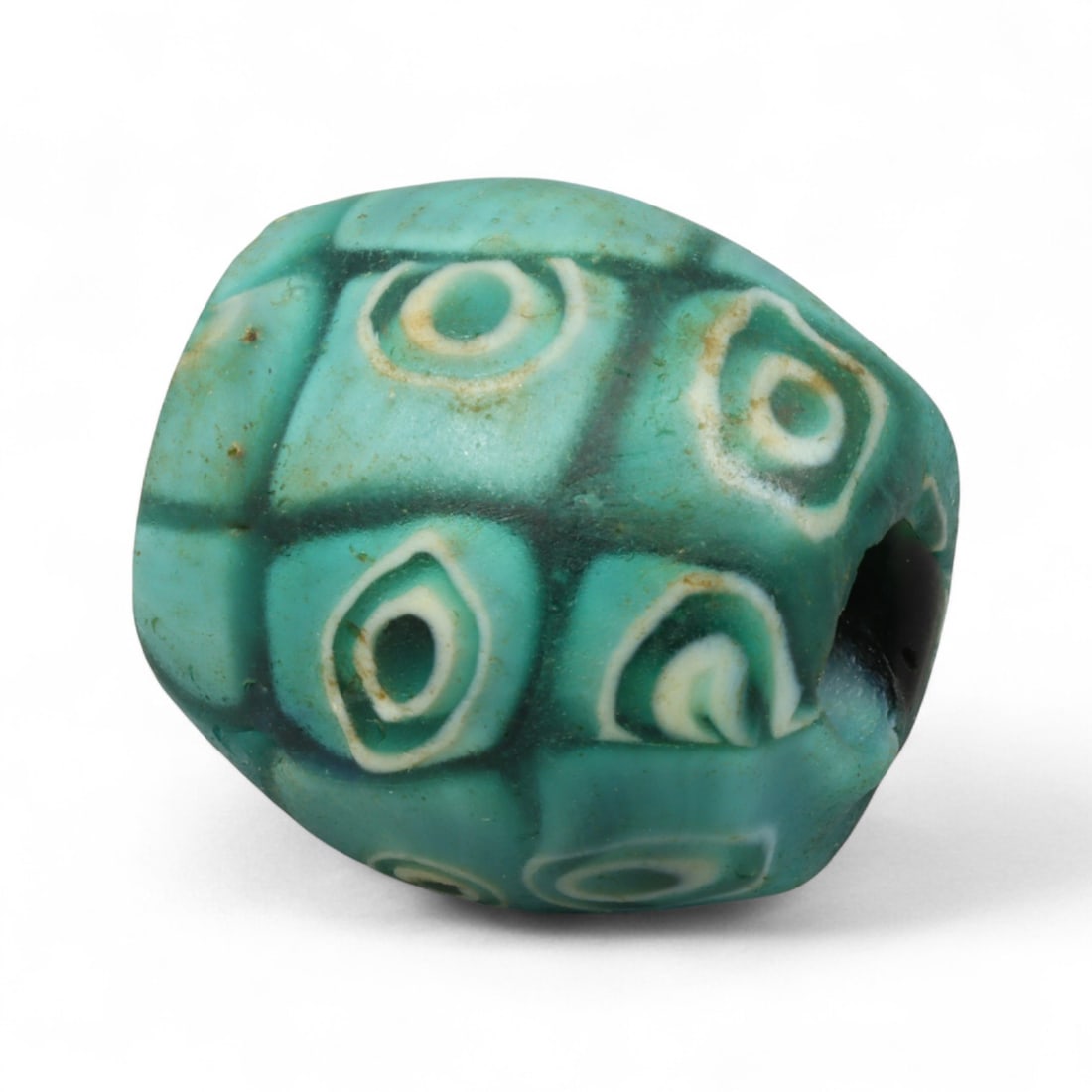 Antique Venetian Aqua Eye-Motif Glass Bead, c. 19th Century, 2.4cm: This antique Venetian bead, dating to the 19th century, is a striking example of the eye-motif tradition in trade bead production. Fashioned in a soft aqua-turquoise glass, the surface is decorated wi