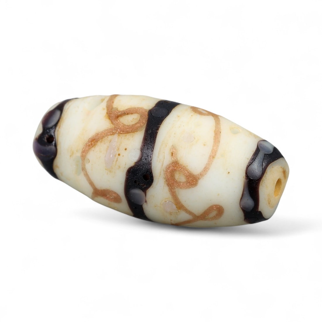 Vintage Venetian White Glass Barrel Bead with Swirled Trails, 20th Century, 3.1cm: This vintage Venetian barrel-shaped bead, dating to the 20th century, combines elegance with playful ornamentation. Crafted in creamy white glass, its surface is encircled by looping amber-gold trails