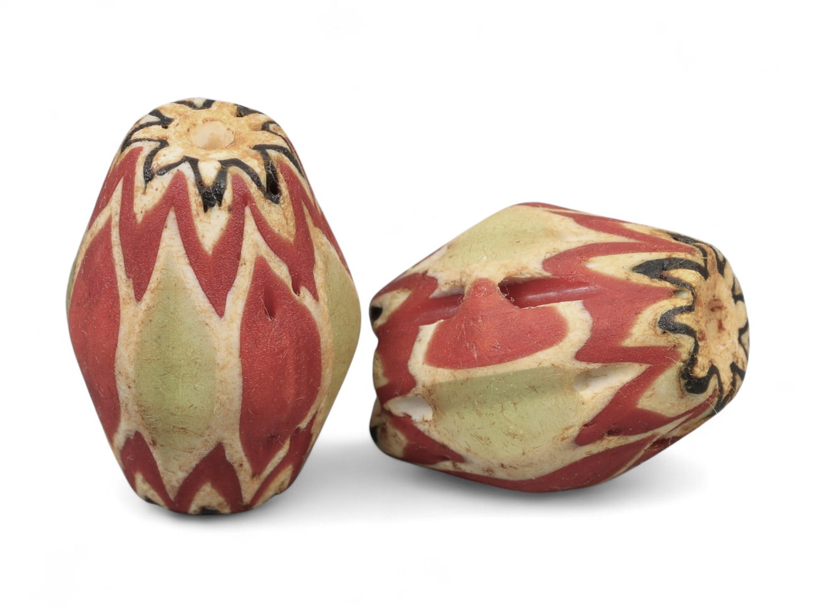 Antique Venetian Chevron Trade Glass Beads, c. 18th-19th Century, 2.2cm: These striking antique glass beads originate from Venice, renowned during the 18th and 19th centuries for its unparalleled glassmaking traditions centered in Murano. Known as chevron beads, they were 