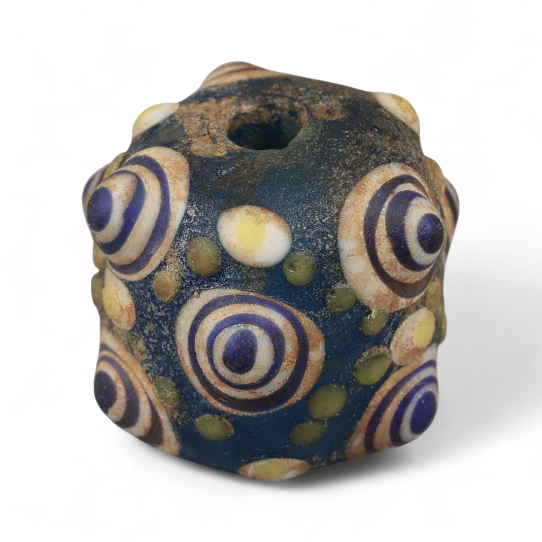 Ancient Western Asiatic Eye Mosaic Glass Bead, c. 4th-2nd Century BCE, 1.8cm: This finely crafted mosaic glass bead, originates from Western Asia and dates to the 4th-2nd century BCE. Beads of this type, often referred to as "eye beads," were highly valued across the ancient Me