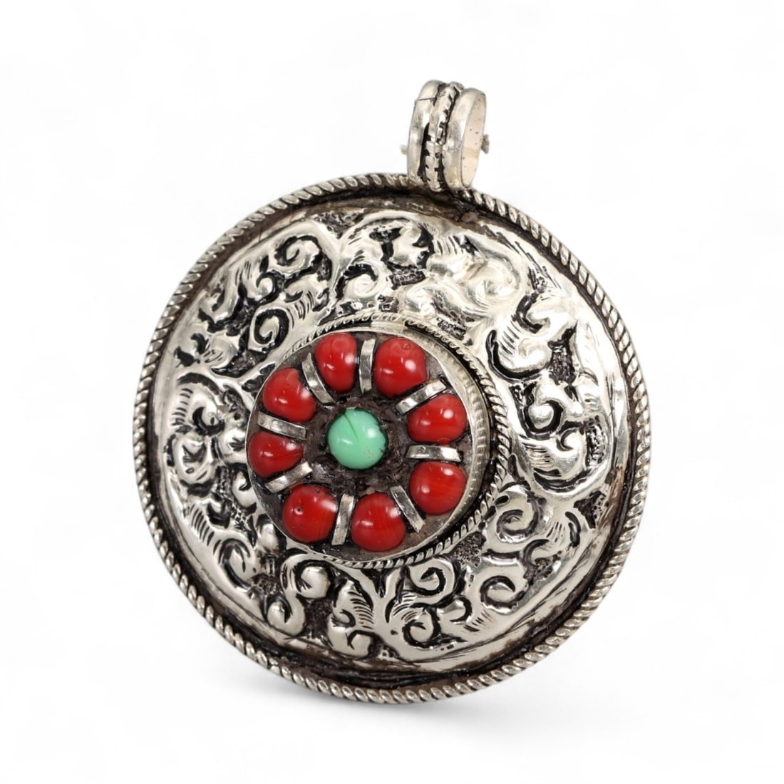Vintage Himalayan Tibetan Coral Turquoise Silver Pendant Locket, 20th Century, 4.3cm: This vintage Himalayan Tibetan pendant locket exemplifies the ornate silverwork and symbolic stone use characteristic of 20th century Himalayan jewelry. The circular form is richly decorated with repo