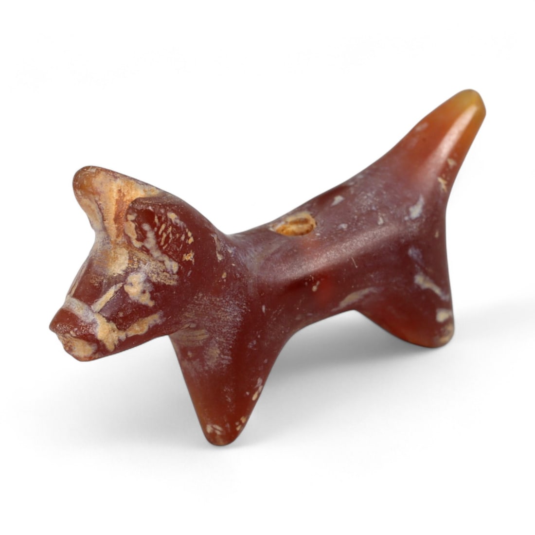 Ancient Coptic Egyptian Carnelian Feline Amulet, c. 5th-7th Century CE, 2.1cm: This finely carved amulet, depicts a feline, sculpted in warm reddish-brown carnelian with lighter mineral veining. Created during the Coptic Egyptian period, c. 5th-7th century CE, it reflects the co