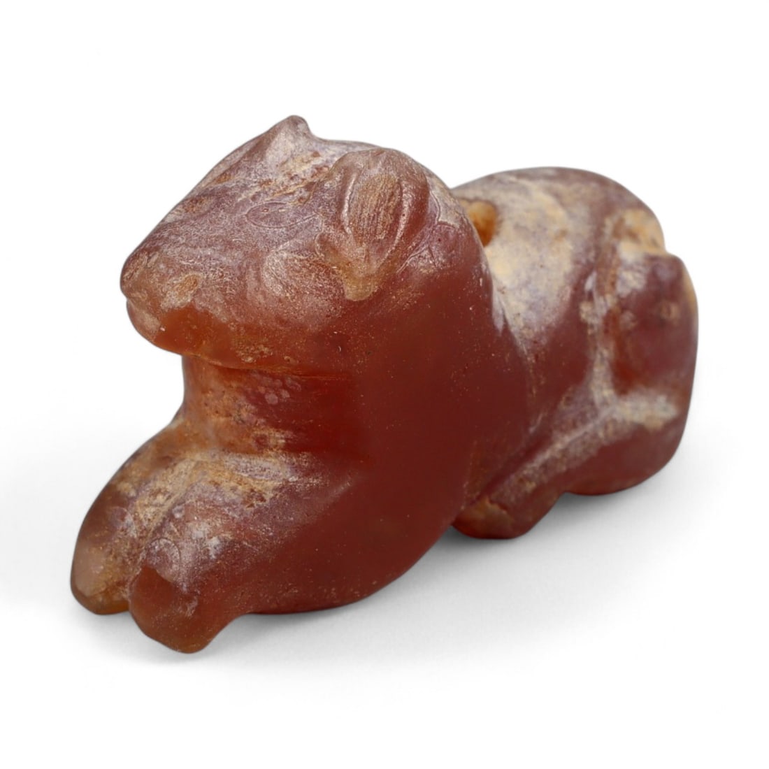 Ancient Coptic Egyptian Carnelian Feline Amulet, c. 5th-7th Century CE, 2.4cm: This finely carved amulet, depicts a feline, sculpted in warm reddish-brown carnelian with lighter mineral veining. Created during the Coptic Egyptian period, c. 5th-7th century CE, it reflects the co