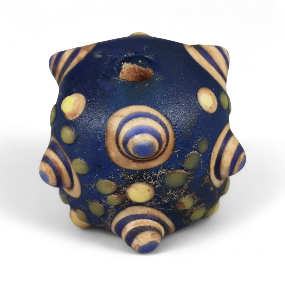 Ancient Western Asiatic Eye Mosaic Glass Bead, c. 4th-2nd Century BCE, 1.6cm: This finely crafted mosaic glass bead, originates from Western Asia and dates to the 4th-2nd century BCE. Beads of this type, often referred to as "eye beads," were highly valued across the ancient Me