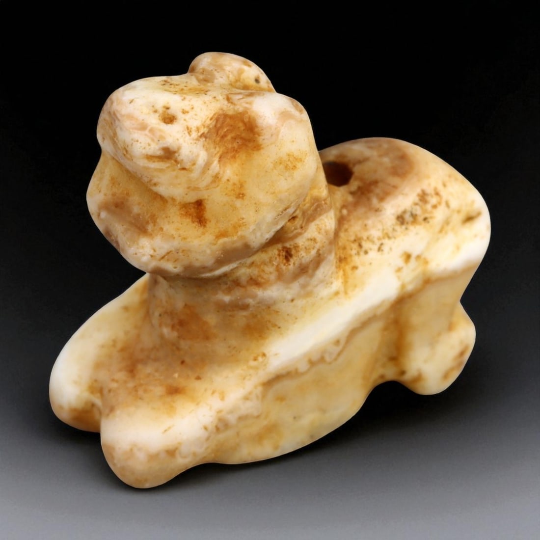 Ancient Elamite Persian Alabaster Lion Cub Amulet, c. 12th-8th Century BCE (2.3 cm): This beautifully carved amulet, depicting a seated lion cub, originates from the Elamite civilization of southwestern Persia - one of the earliest and most artistically refined cultures of the ancient