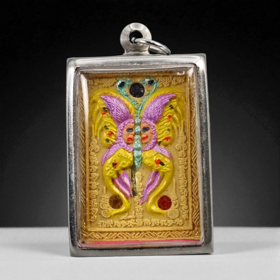 Vintage Thai Buddhist Amulet in Ornate Framed Setting, 20th Century, 5cm: This vintage Thai Buddhist amulet exemplifies the devotional artistry that continues to define Thailand's sacred craftsmanship. Encased within an intricately detailed frame, the amulet displays refine