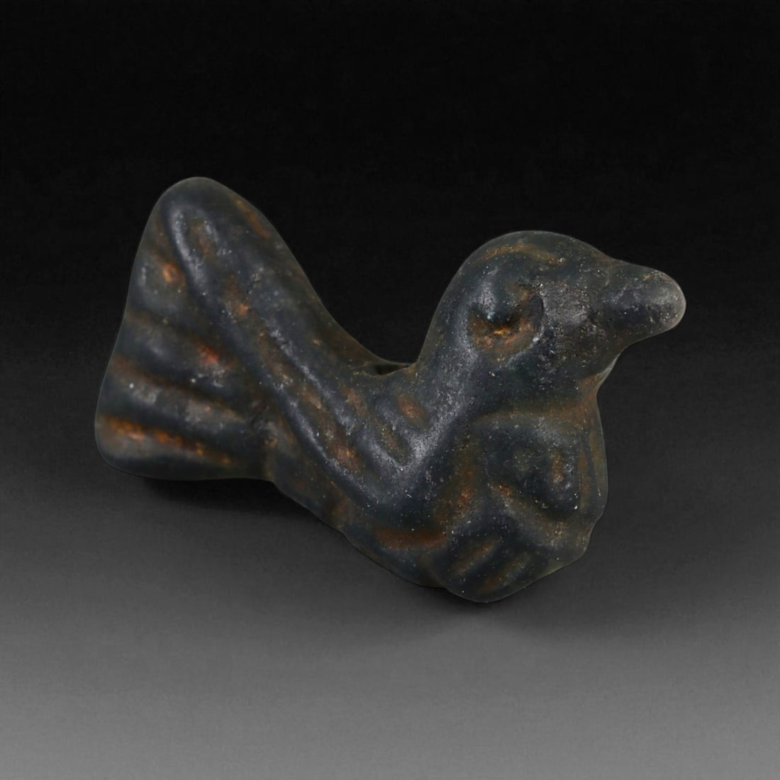 Ancient Egyptian Black Stone Bird Amulet, c. Late Period, 7th-4th Century BCE 21 mm: This small yet finely modeled black stone amulet, carved in the form of a bird, dates to Egypt's Late Period, circa 7th-4th centuries BCE. Birds held profound symbolic importance in Egyptian religion,