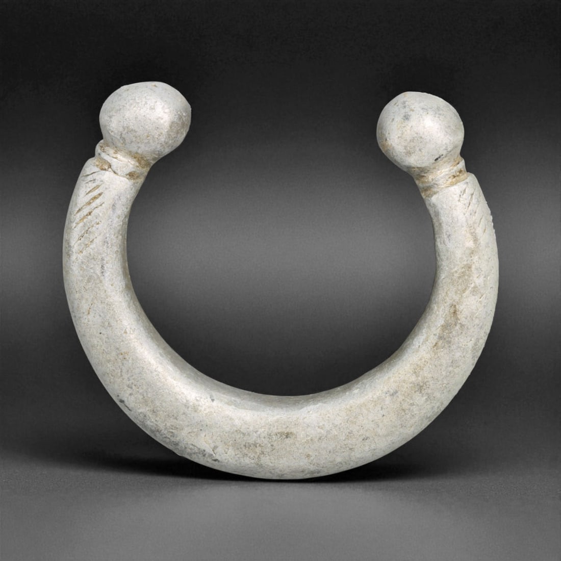 Antique West African Bulb Terminal Aluminum Trade Bracelet, Early 20th Century, 7cm, 58g: This lightweight antique aluminum bracelet, likely produced in West Africa during the early 20th century, reflects the practical elegance of currency adornments used across tribal economies. Its form