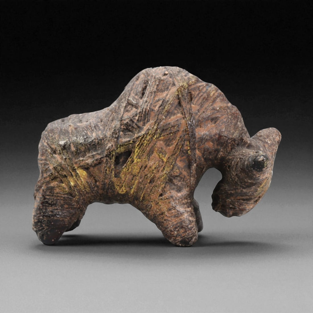 Antique Thai Protective Buffalo Effigy Folk Amulet, c. 19th-20th Century CE, 60g: This hand-carved buffalo figure from 19th- to early 20th-century rural Thailand embodies the deep spiritual and agricultural symbolism central to Southeast Asian folk belief systems. Created from dens