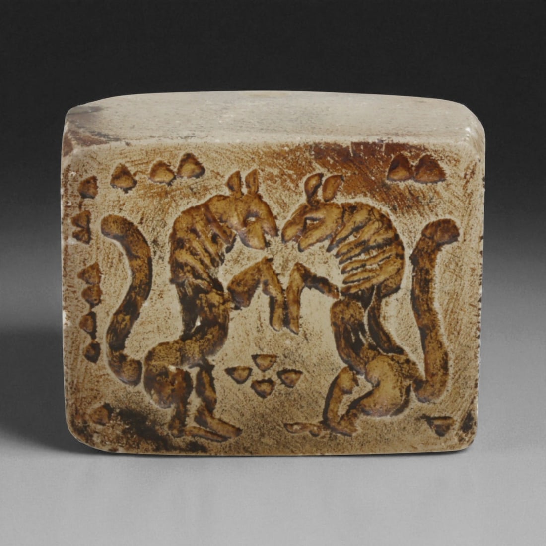 Ancient Sasanian Chalcedony Block Stamp Seal with Confronted Animals, c. 3rd-6th Century CE, 69g: This finely carved chalcedony block stamp seal, weighing 69 grams and measuring 4 x 2.5 cm, dates to the Sasanian Empire (c. 224-651 CE), one of the great powers of late antiquity. The seal face prese
