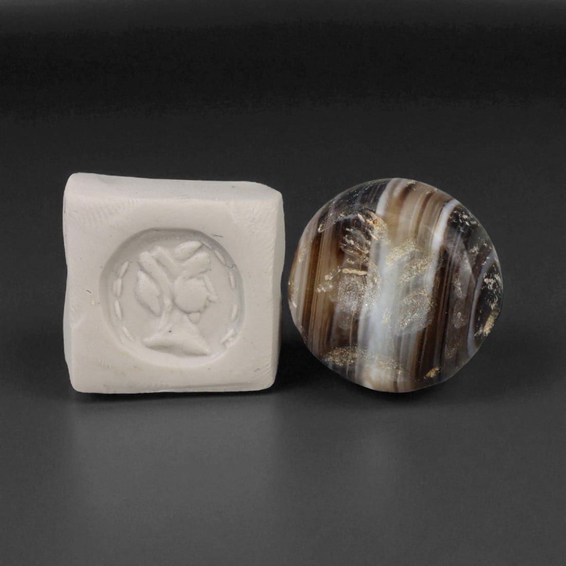 Ancient Parthian-Sasanian Noble Profile Banded Agate Stamp Seal, c. 2nd-4th Century CE, 2.8g: This elegant banded agate stamp seal, dating to the Parthian or early Sasanian period (circa 2nd to 4th century CE), depicts the finely carved profile of a noble figure-possibly a high-ranking officia