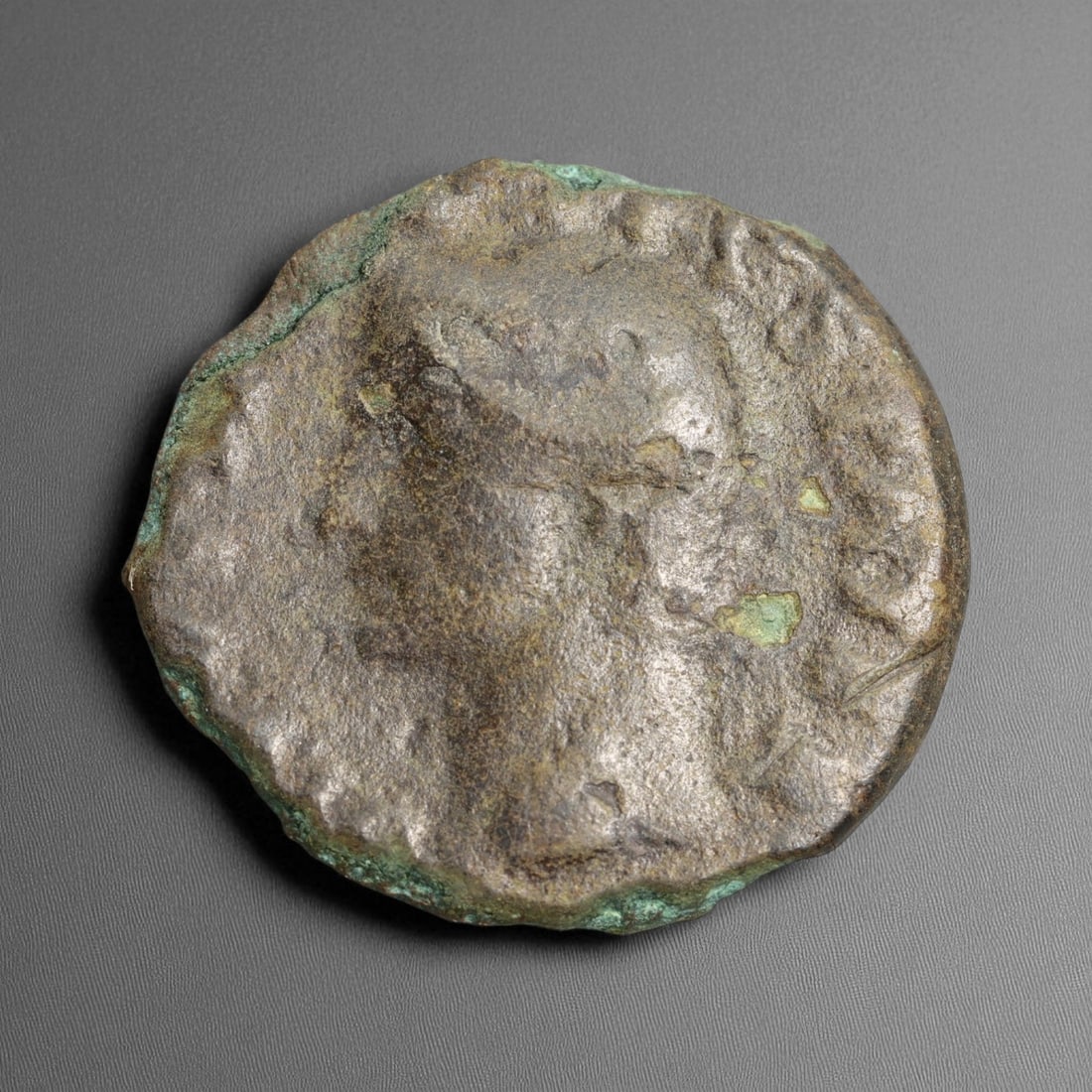 ROMAN EMPIRE: Imperial Authority - Bronze Coin, c. 1st-3rd Century AD, 25mm: Struck during the turbulent decades of the later Roman Empire, this 19mm bronze coin reflects the enduring symbolism of imperial control amidst crisis. Its compact yet deliberate design likely feature