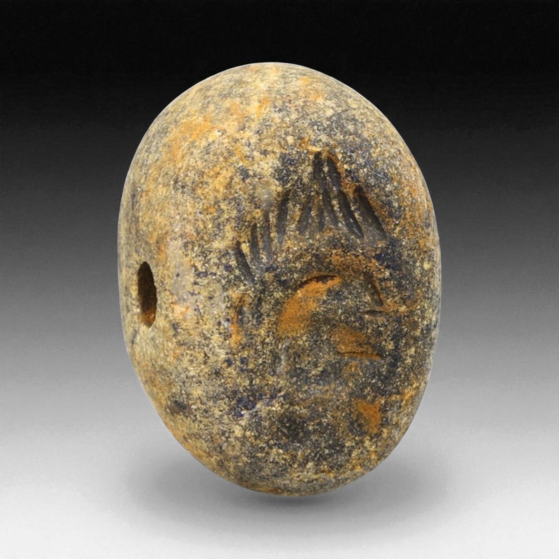 Ancient Elamite Bifacial Stamp Seal of Radiant Head Motif in Lapis Lazuli, c. 2500-1800 BCE, 10g: This striking oval-shaped bifacial stamp seal, carved from richly patinated lapis lazuli with warm ochre inclusions, originates from the Elamite-Indus interaction period between 2500 and 1800 BCE. Mea
