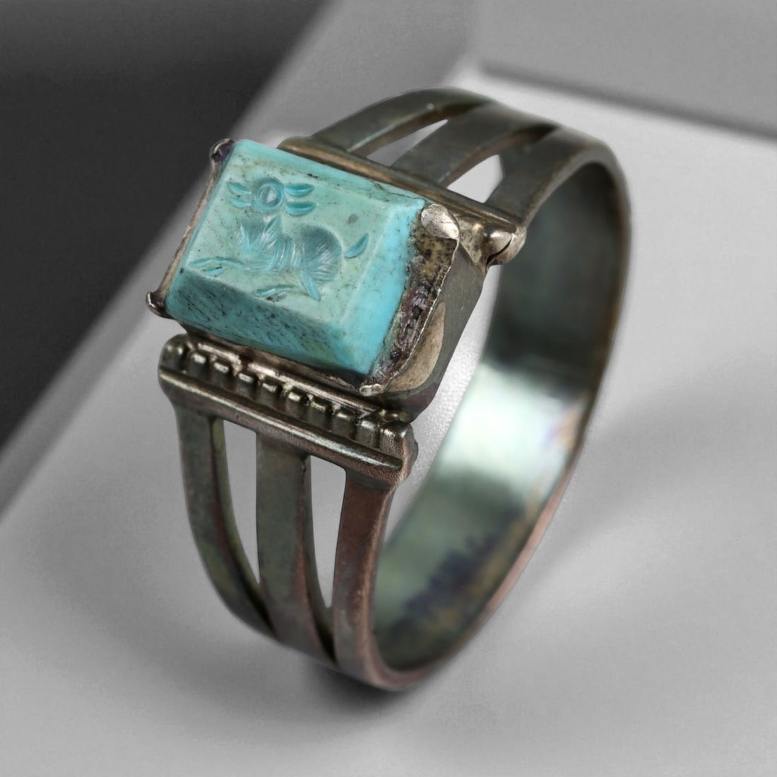 Antique Persian Turquoise Intaglio Silver Ring with Animal Motif, c. 19th Century 5g: This elegant antique Persian ring from the Qajar Dynasty (1789-1925) features a rectangular turquoise intaglio carved with a stylized animal figure. Turquoise, long celebrated as the national gemstone