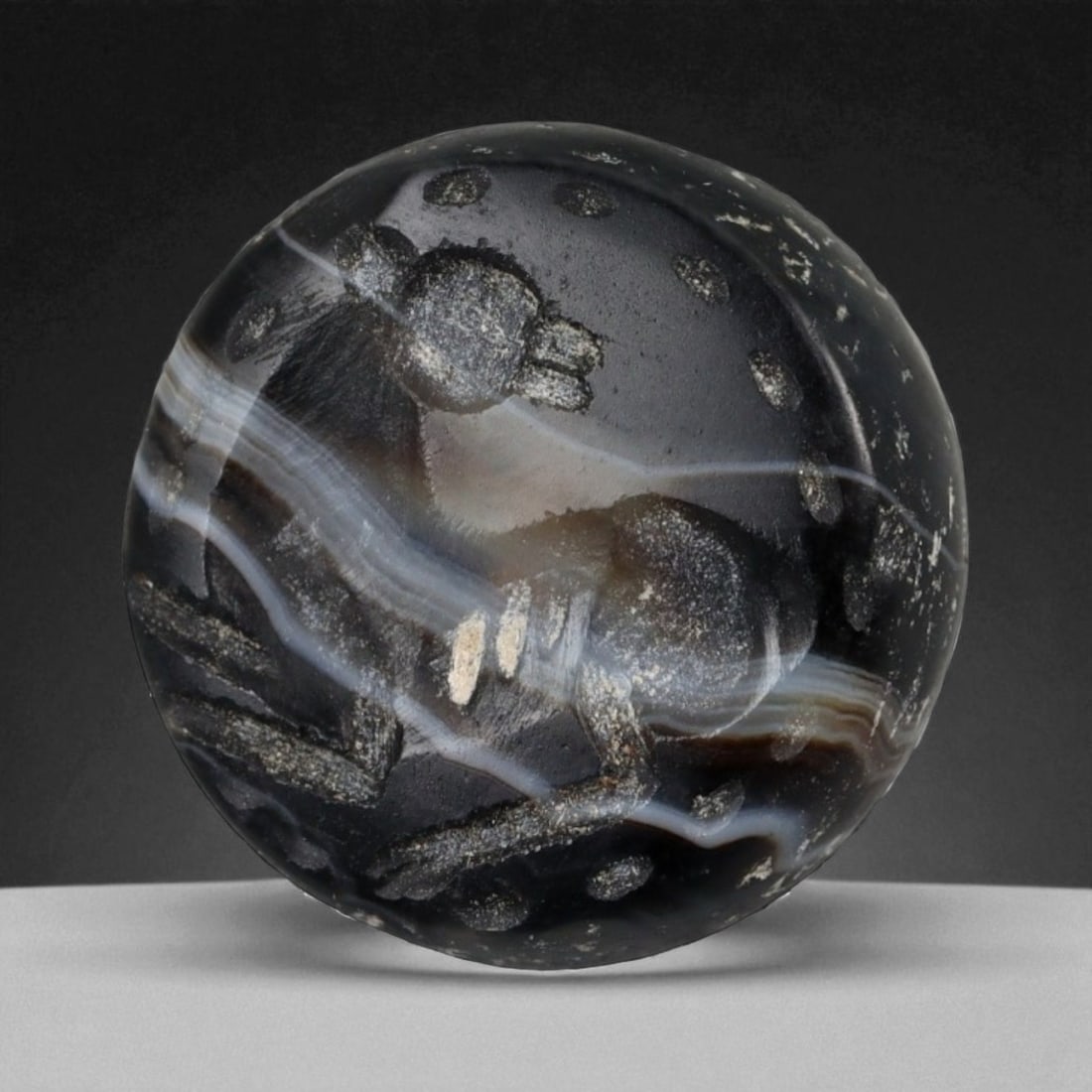 Ancient Parthian-Sasanian Agate Stamp Seal of Grazing Ibex, c. 2nd-4th Century CE, 2.9g: This masterfully carved agate stamp seal, dating to the Parthian or early Sasanian period (circa 2nd to 4th century CE), features a stylized depiction of a grazing ibex-an enduring symbol of strength,