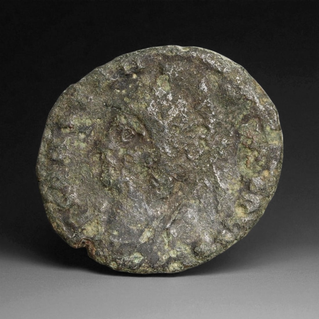 ROMAN EMPIRE: Imperial Authority - Bronze Coin, c. 1st-3rd Century AD, 17mm: Struck during the turbulent decades of the later Roman Empire, this 19mm bronze coin reflects the enduring symbolism of imperial control amidst crisis. Its compact yet deliberate design likely feature
