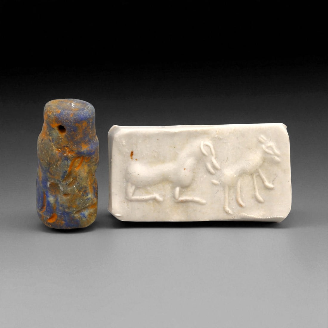 Ancient Elamite Twin Antelope Cylinder Seal in Lapis Lazuli, c. 2500-1800 BCE, 4.7g: This rare and captivating cylinder seal, expertly carved from deep blue lapis lazuli, dates to the Elamite-Indus interaction period between 2500 and 1800 BCE. Measuring approximately 2.2 cm in height 