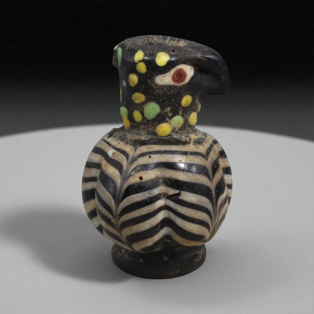 Ancient Islamic Glass Falcon-Head Vessel, c. 9th-10th Century CE 10g (1 of 2)