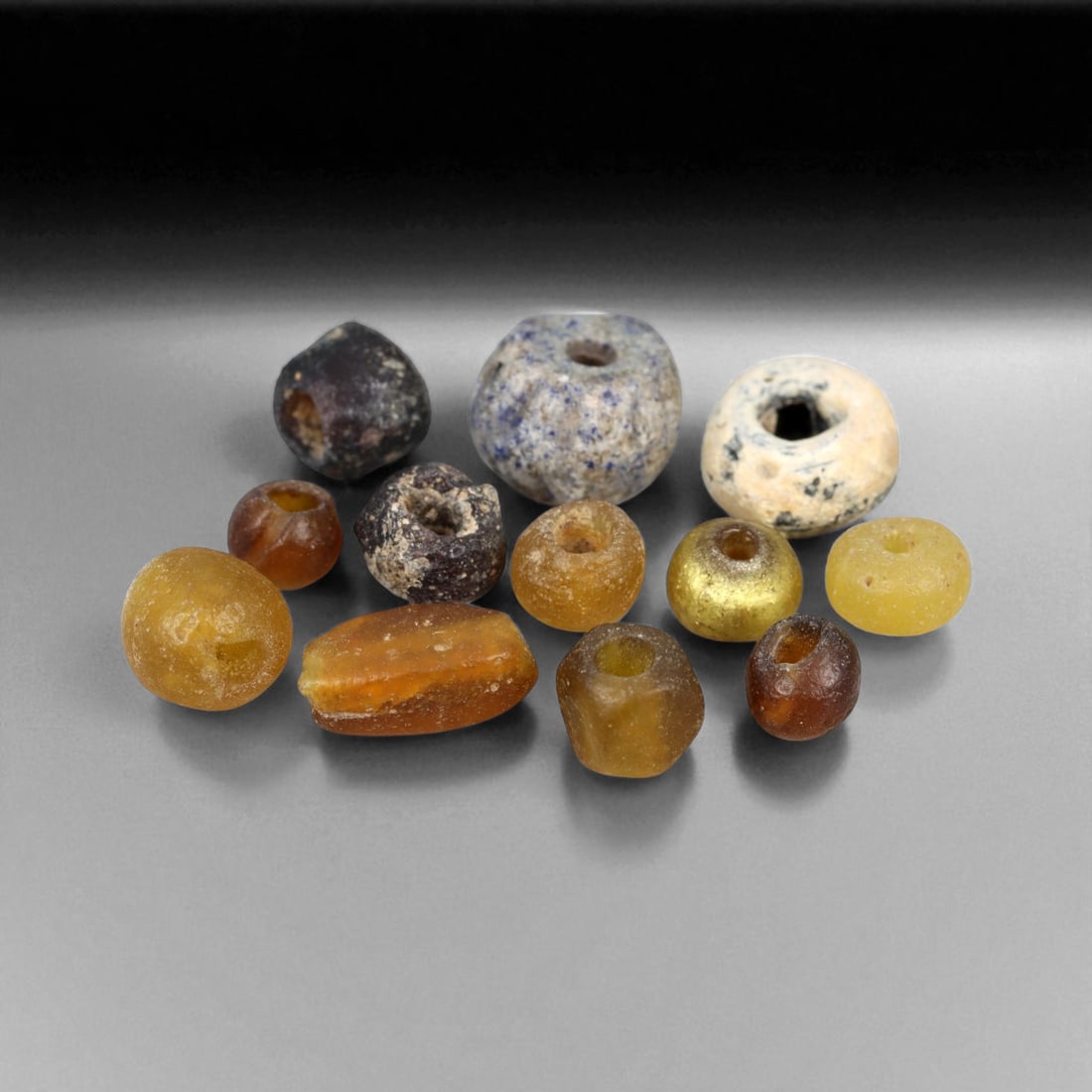 Ancient Roman Amber and Gold-Toned Glass Bead Collection, c. 1st-3rd Century CE, 3.7g (12pcs) (1 of 1)