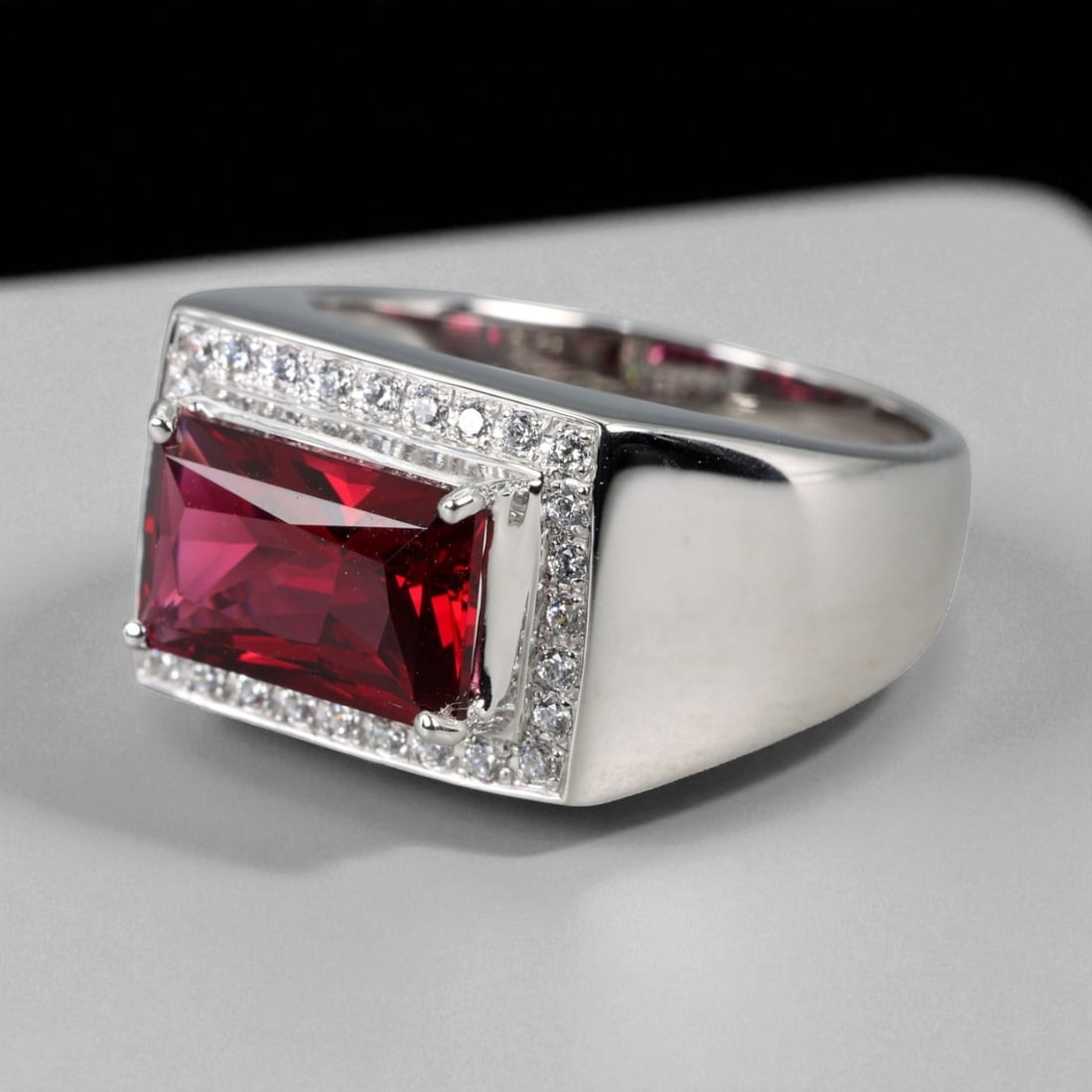 Ruby Sovereign Crest Pattern 925 Silver Ring with Chatham Red Gemstone, 11.25 US: This distinguished 925 silver ring features the "Ruby Sovereign Crest" pattern - a bold expression of regal elegance and precise geometry. At its core lies a rectangular-cut Chatham ruby, glowing with