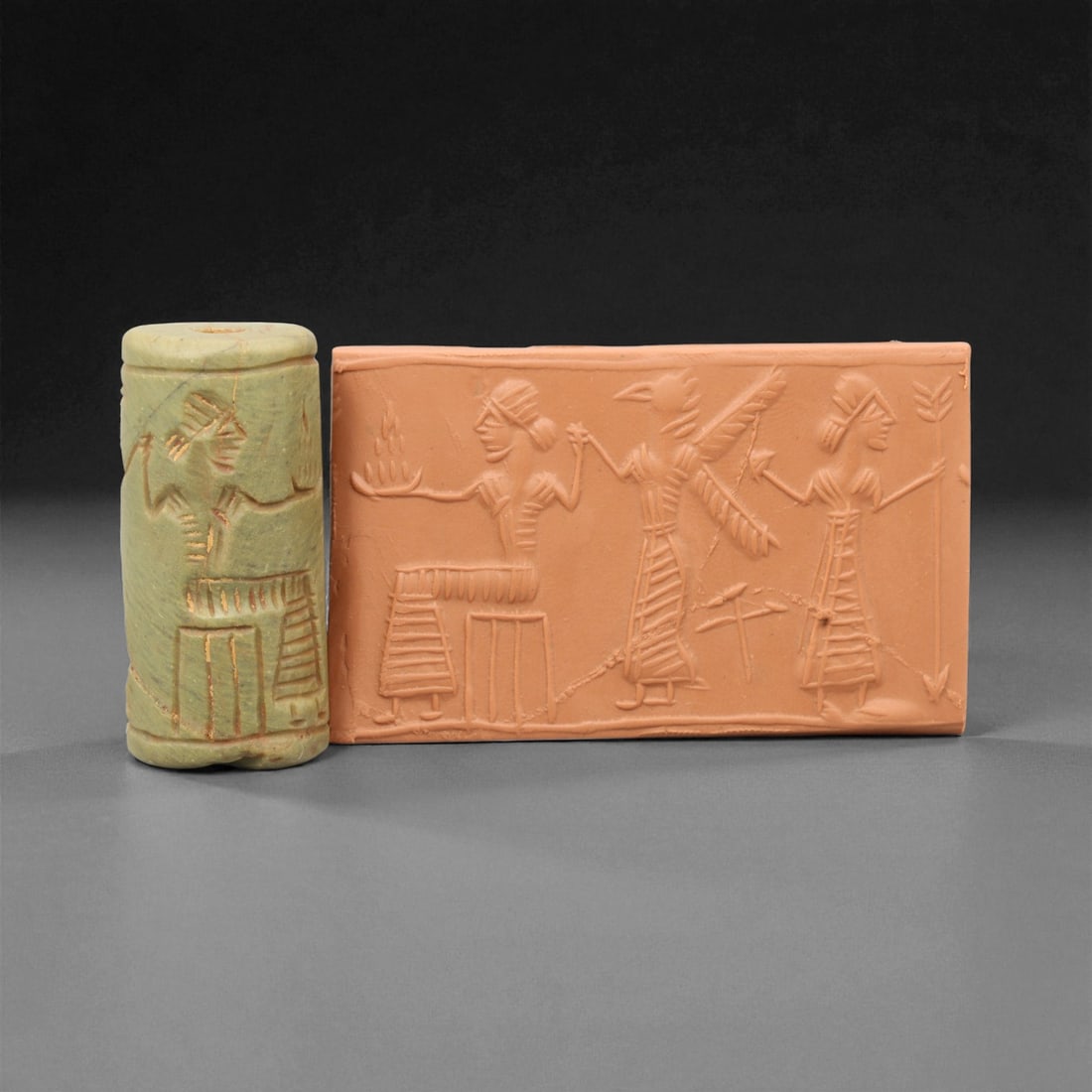 Ancient Akkadian Ritual Procession Motif Serpentine Cylinder Seal, c. 2350-2150 BCE, 4.2 cm: This remarkable serpentine cylinder seal, dating to the Akkadian Empire (circa 2350-2150 BCE), depicts a ritual procession of three figures rendered in crisp linear style. At the center, a seated deit