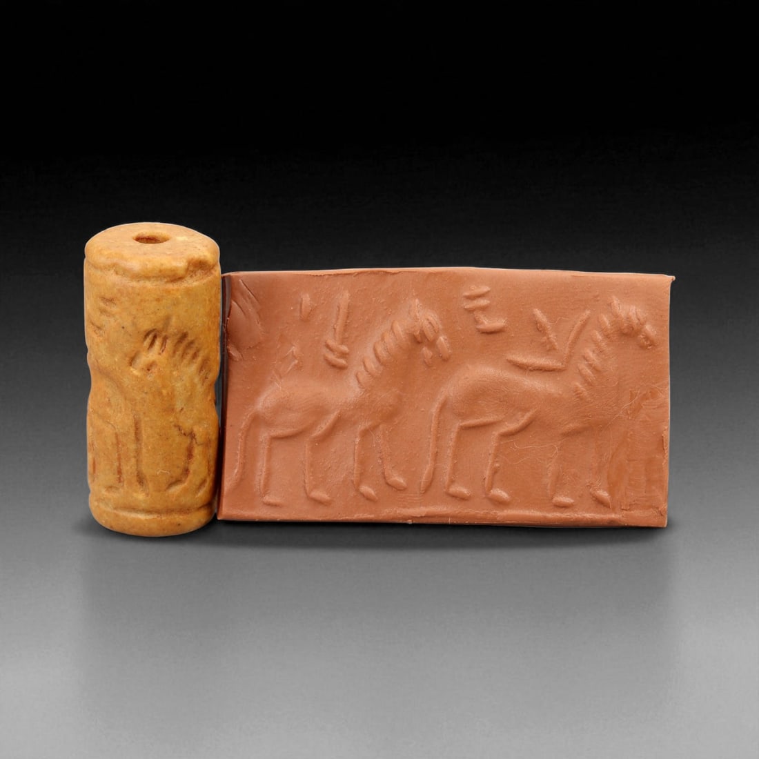 Ancient Early Dynastic Processional Equids Motif Steatite Cylinder Seal, c. 2900-2350 BCE, 4.2 cm: This finely carved cylinder seal, executed in warm-toned steatite, dates to the Early Dynastic Period of Mesopotamia (circa 2900-2350 BCE). The design depicts a rhythmic procession of equids, possibly