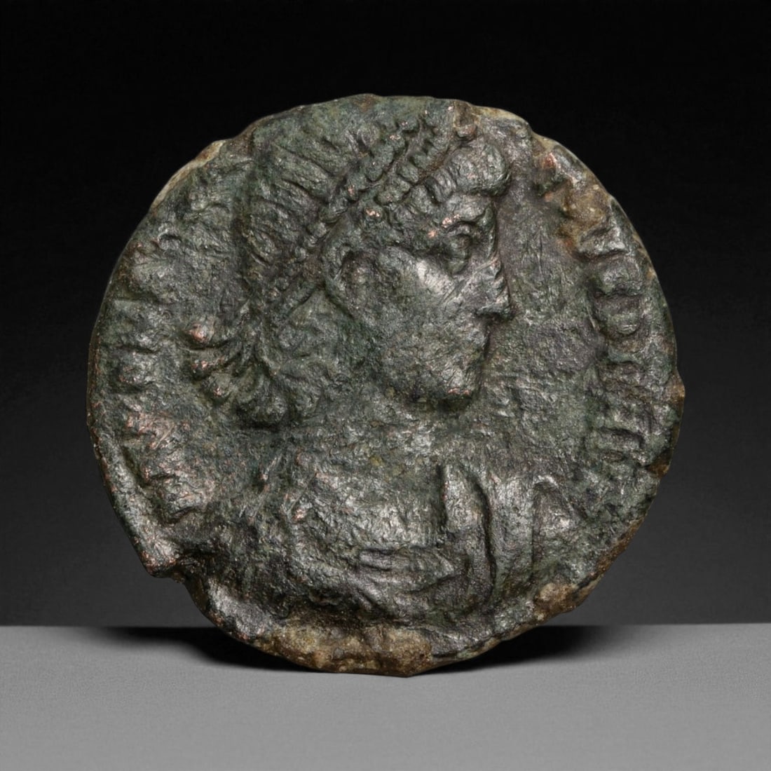 ROMAN EMPIRE: Imperial Authority - Bronze Coin, c. 1st-3rd Century AD, 17mm: Struck during the turbulent decades of the later Roman Empire, this 19mm bronze coin reflects the enduring symbolism of imperial control amidst crisis. Its compact yet deliberate design likely feature