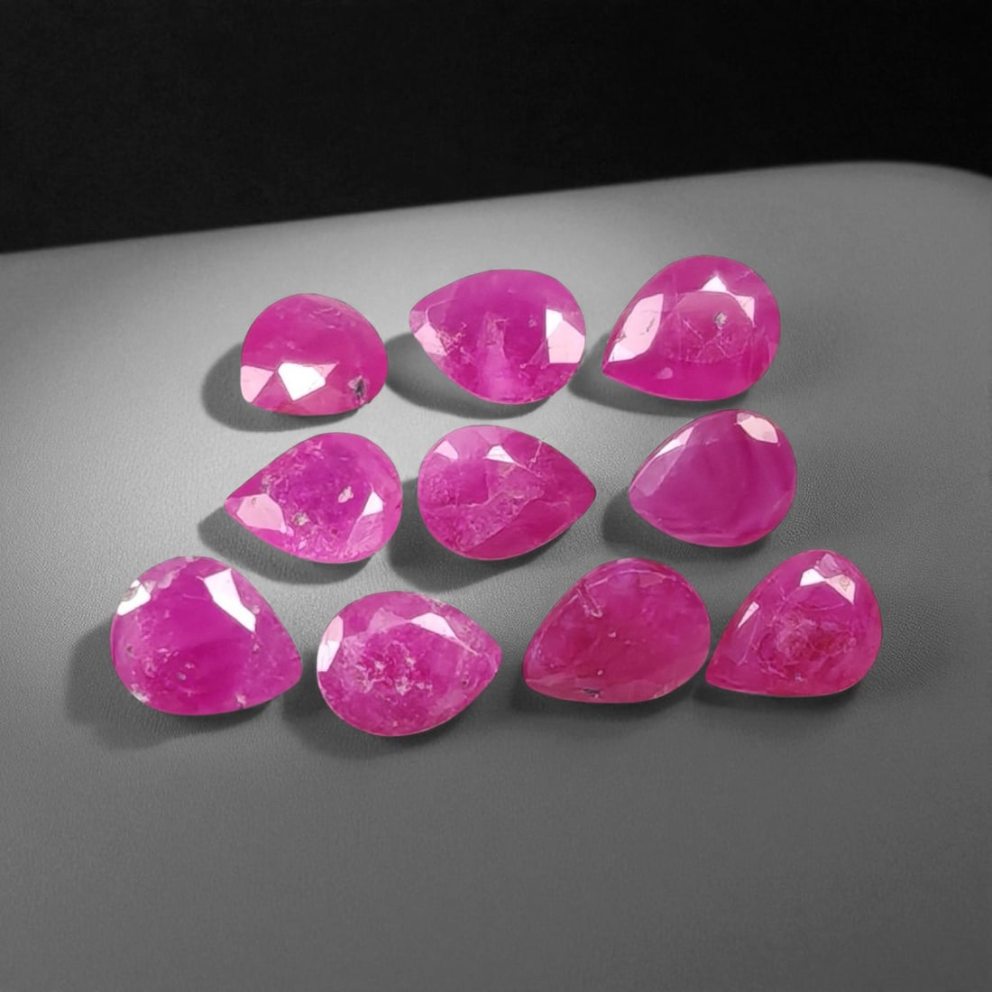 3.38 Carats Vivid Pinkish Red Ruby Pear Lot - Natural Mozambique Stones: This lively lot of ruby pear glows with an intense pinkish-red tone that captures the eye with warmth and vibrancy. Each gem, measuring approximately 4.4x3.5x2.6mm, reveals a balance of medium to deep