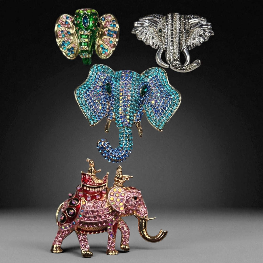 Set of Four Elephant Brooches - Multicolor Crystal and Enamel Designs: This striking quartet of elephant-themed brooches showcases a fusion of vibrant color, sparkle, and artistry, each piece offering its own interpretation of the majestic animal. Measuring between 5 and