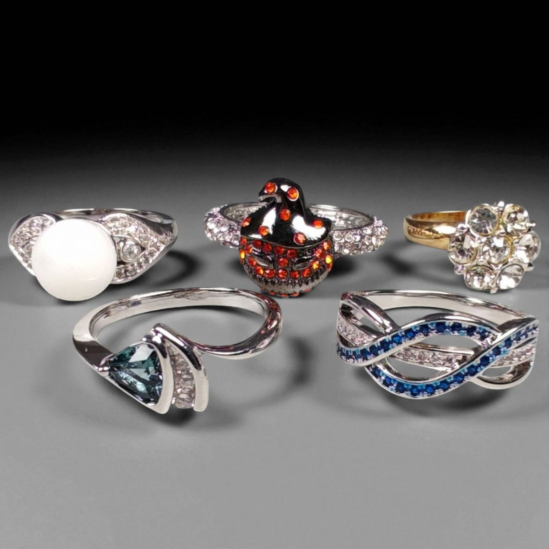 Lot of 5 Vintage and Contemporary Fashion Ring Lot, c. 20th-21st Century: This assorted lot of vintage and contemporary fashion rings offers a vibrant collection of statement pieces showcasing diverse styles, materials, and craftsmanship. Designed for decorative wear rather