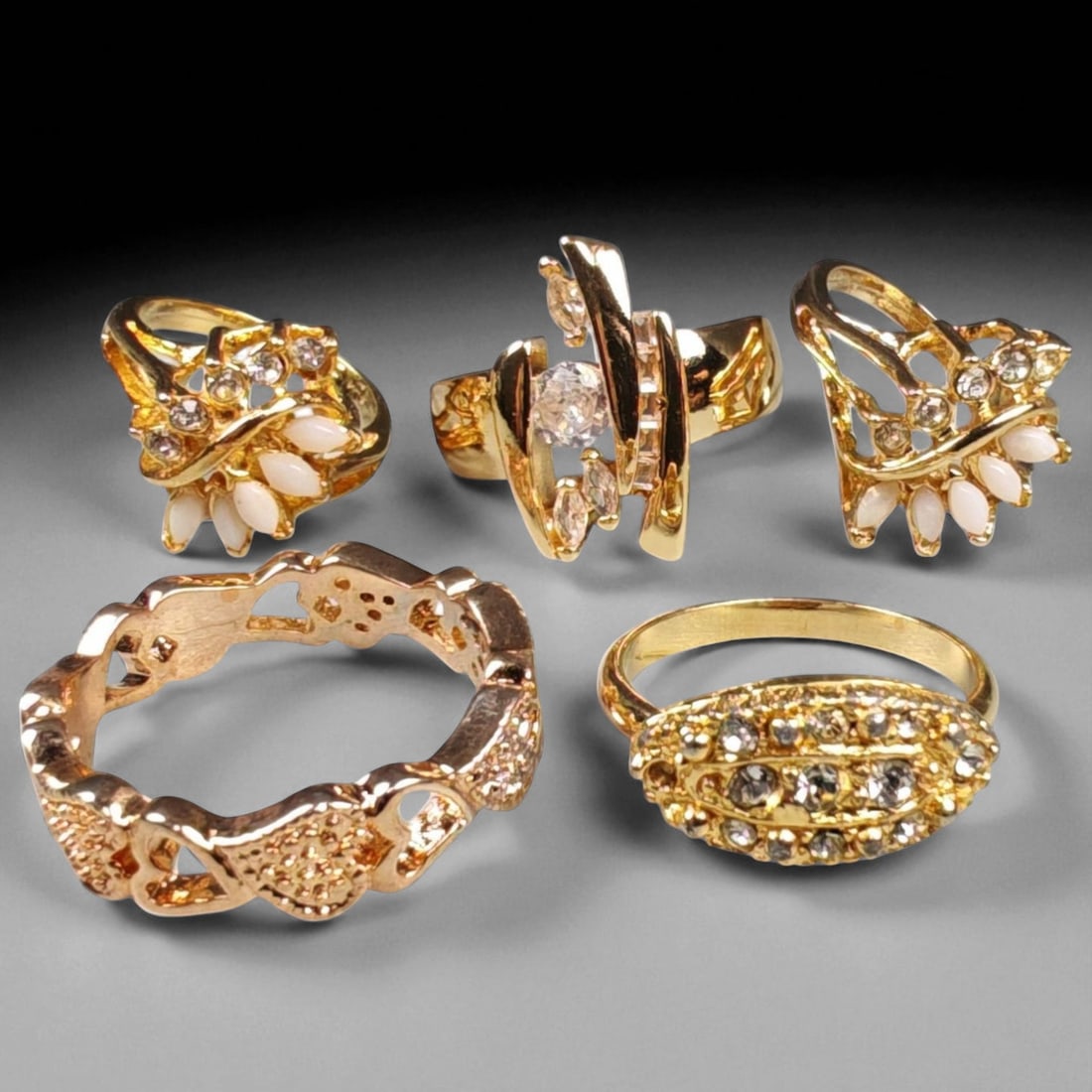 Lot of 5 Vintage and Contemporary Fashion Ring Lot, c. 20th-21st Century: This assorted lot of vintage and contemporary fashion rings offers a vibrant collection of statement pieces showcasing diverse styles, materials, and craftsmanship. Designed for decorative wear rather
