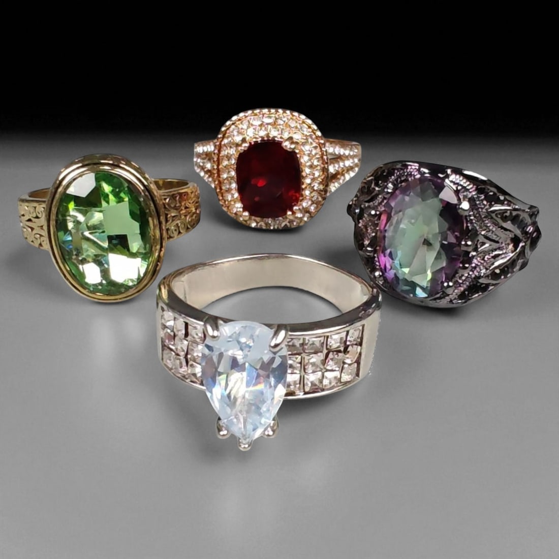Lot of 4 Vintage and Contemporary Fashion Ring Lot, c. 20th-21st Century: This assorted lot of vintage and contemporary fashion rings offers a vibrant collection of statement pieces showcasing diverse styles, materials, and craftsmanship. Designed for decorative wear rather