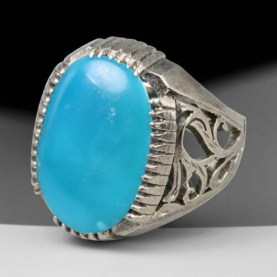 Antique Persian Turquoise Filigree Silver Ring, c. 19th-20th Century, US Size 9.5: This refined antique silver ring showcases the elegant artistry of Persian craftsmanship from the late Qajar to early Pahlavi period, characterized by its balance of grandeur and graceful simplicity. 