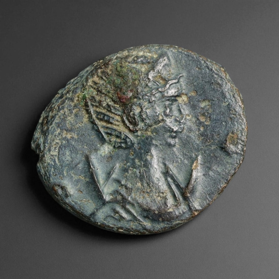 ROMAN EMPIRE: Imperial Authority - Bronze Coin, c. 1st-3rd Century AD, 17mm: Struck during the turbulent decades of the later Roman Empire, this 19mm bronze coin reflects the enduring symbolism of imperial control amidst crisis. Its compact yet deliberate design likely feature