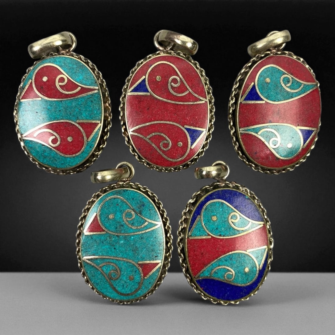 Vintage Himalayan Tribal Pendants, Lot of 5, c. 20th Century, 3-4 cm: These vintage Himalayan pendants capture the spirit and artistry of traditional jewelry from the highlands of Tibet and Nepal. Crafted with vibrant inlay work and detailed metal framing, they exemplif