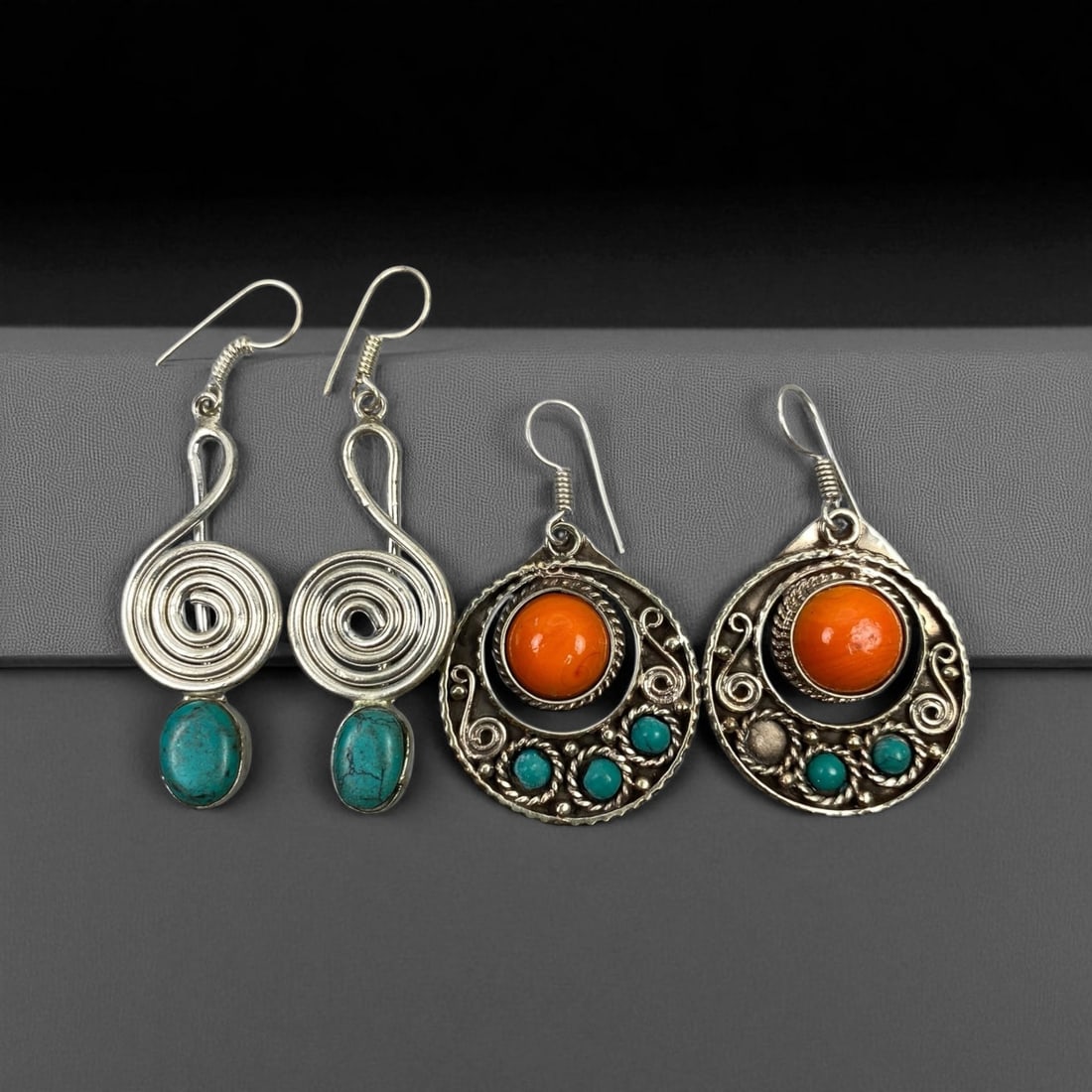 Vintage Himalayan-Style Silver Earrings, Set of Two Pairs, c. Mid-20th Century (3-4 cm): This charming set of two vintage earring pairs showcases the distinctive Himalayan aesthetic, blending traditional artistry with bold, colorful design. Crafted in silver-tone metal with vivid stone in