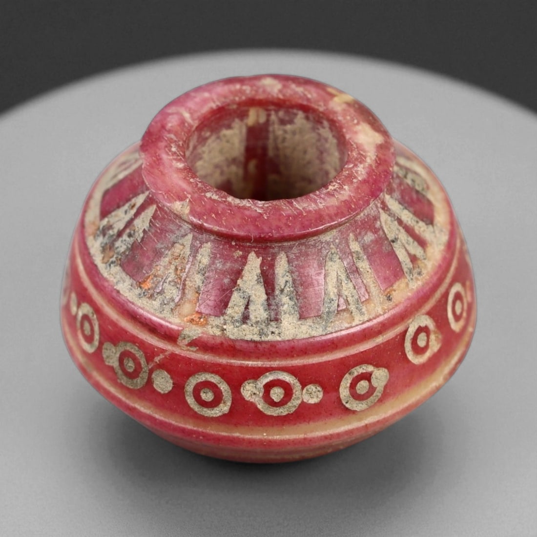 Ancient Medieval Nishapur Silk Road Bone Spindle Whorl, c. 9th-11th Century CE, 1.7cm: This finely carved spindle whorl originates from Nishapur, an important Silk Road city in medieval northeastern Iran, dating to approximately the 9th-11th century CE. Such spindle whorls were essentia