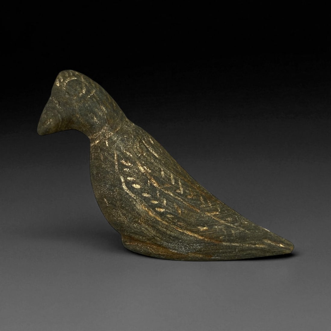 Ancient Elamite Steatite Bird Effigy, c. 3rd-2nd Millennium BCE 8.5 cm: This elegant bird effigy, carved from dark steatite and measuring 8.5 cm in length, originates from the ancient Elamite culture of southwestern Iran. The Elamites, contemporaries of early Mesopotamian