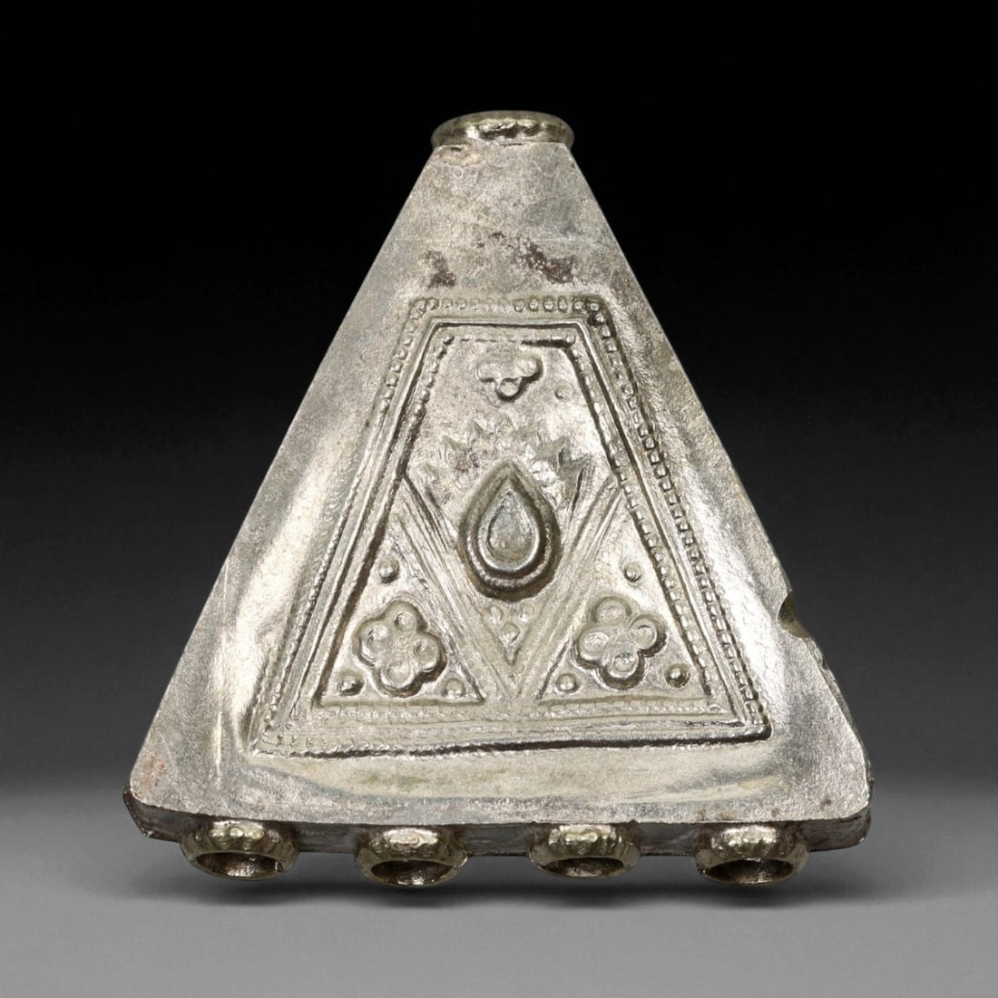 Antique Himalayan Triangular Silver Amulet Pendant, c. 19th Century, 5cm: This striking triangular silver amulet pendant originates from the Himalayan cultural region, most likely Nepal or Tibet, and dates to the 19th century. Such pendants, often worn suspended from a neck