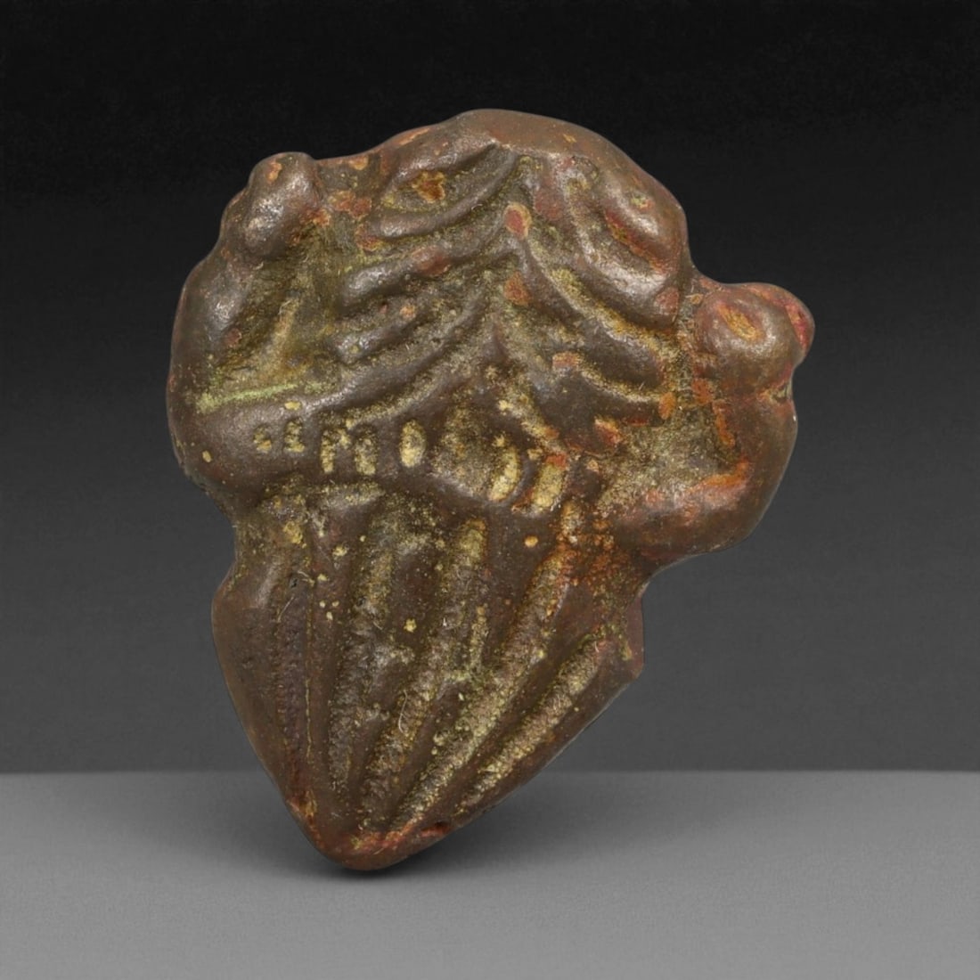 Ancient Phoenician Bronze Zoomorphic Amulet, c. 8th-6th Century BCE 19g: This compact bronze amulet, weighing 19 g and measuring 3 cm, originates from the Phoenician world, c. 8th-6th century BCE. The amulet is cast in a stylized zoomorphic form, its front showing ridged, 