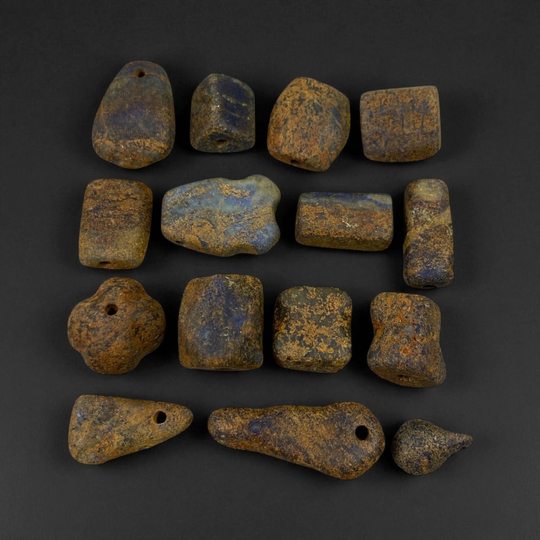 Ancient Bactrian Lapis Lazuli Beads, c. 2nd Millennium BCE, 1-2cm: These ancient lapis lazuli beads originate from the region once known as Bactria, located in present-day northern Afghanistan - a civilization renowned for its early mastery of gemstone craftsmanship 
