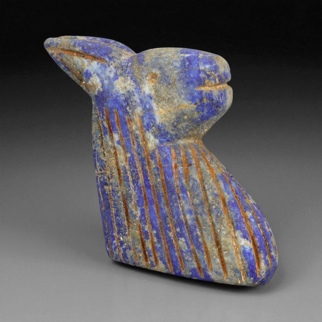 Ancient Bactrian Lapis Lazuli Horse Bust Amulet, c. 2nd-1st Millennium BCE, 6cm: This finely sculpted lapis lazuli effigy of a horse's head originates from ancient Bactria, circa 2nd-1st millennium BCE - a civilization that flourished across modern northern Afghanistan and souther
