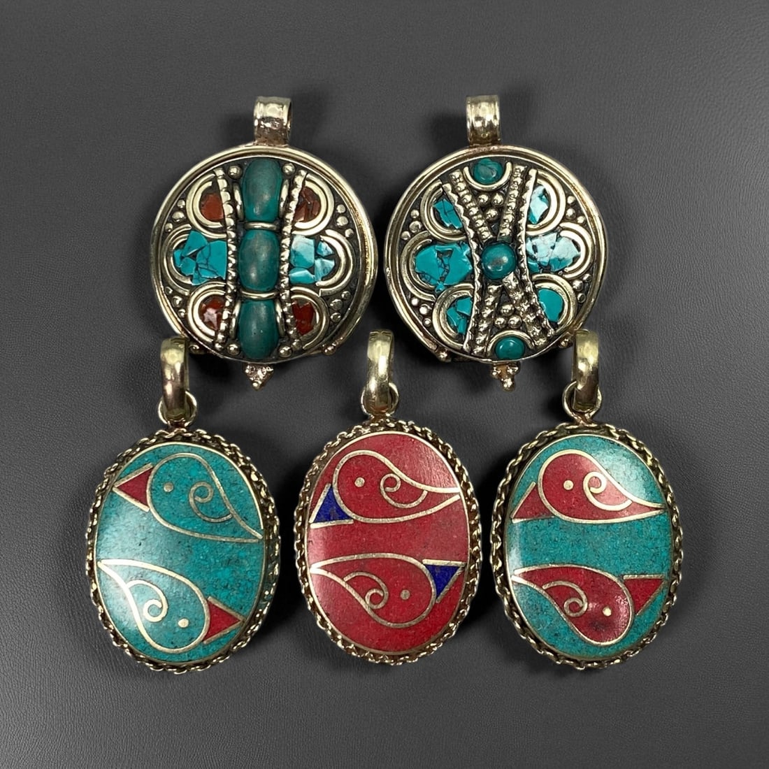 Vintage Himalayan Tribal Pendants, Lot of 5, c. 20th Century, 3-4 cm: These vintage Himalayan pendants capture the spirit and artistry of traditional jewelry from the highlands of Tibet and Nepal. Crafted with vibrant inlay work and detailed metal framing, they exemplif