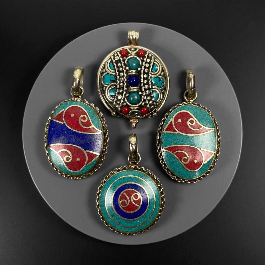 Vintage Himalayan Tribal Pendants, Lot of 4, c. 20th Century, 3-4 cm: These vintage Himalayan pendants capture the spirit and artistry of traditional jewelry from the highlands of Tibet and Nepal. Crafted with vibrant inlay work and detailed metal framing, they exemplif