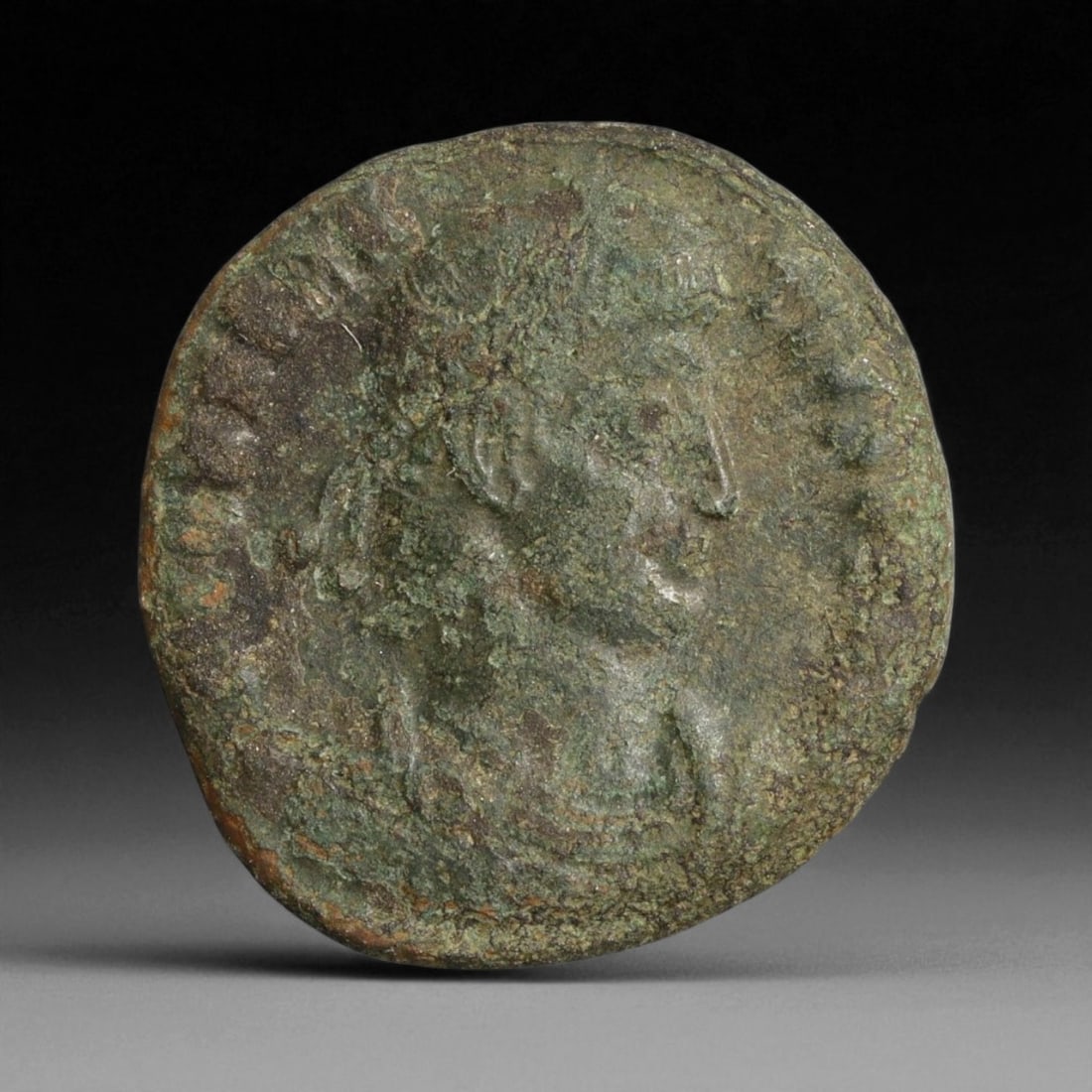 ROMAN EMPIRE: Imperial Authority - Bronze Coin, c. 1st-3rd Century AD, 18mm: Struck during the turbulent decades of the later Roman Empire, this 19mm bronze coin reflects the enduring symbolism of imperial control amidst crisis. Its compact yet deliberate design likely feature