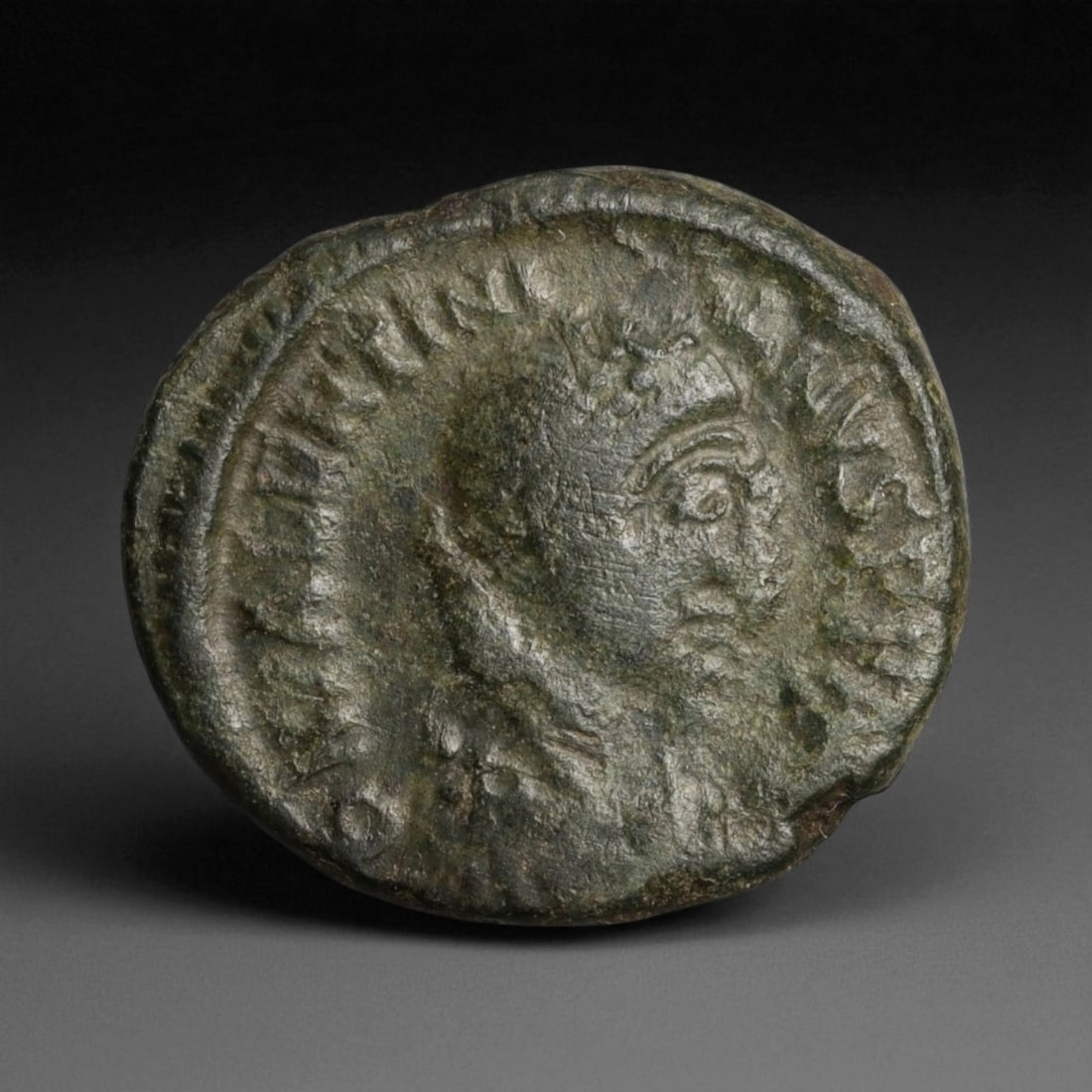 ROMAN EMPIRE: Imperial Authority - Bronze Coin, c. 1st-3rd Century AD, 17mm: Struck during the turbulent decades of the later Roman Empire, this 19mm bronze coin reflects the enduring symbolism of imperial control amidst crisis. Its compact yet deliberate design likely feature