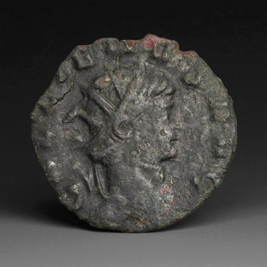 ROMAN EMPIRE: Imperial Authority - Bronze Coin, c. 1st-3rd Century AD, 18mm: Struck during the turbulent decades of the later Roman Empire, this 19mm bronze coin reflects the enduring symbolism of imperial control amidst crisis. Its compact yet deliberate design likely feature