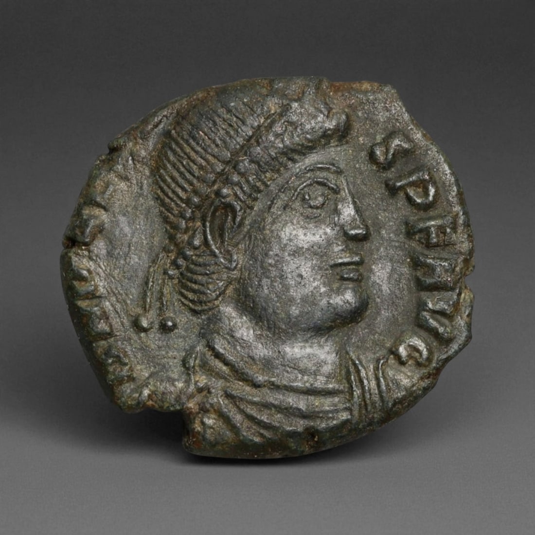 ROMAN EMPIRE: Imperial Authority - Bronze Coin, c. 1st-3rd Century AD, 17mm: Struck during the turbulent decades of the later Roman Empire, this 19mm bronze coin reflects the enduring symbolism of imperial control amidst crisis. Its compact yet deliberate design likely feature