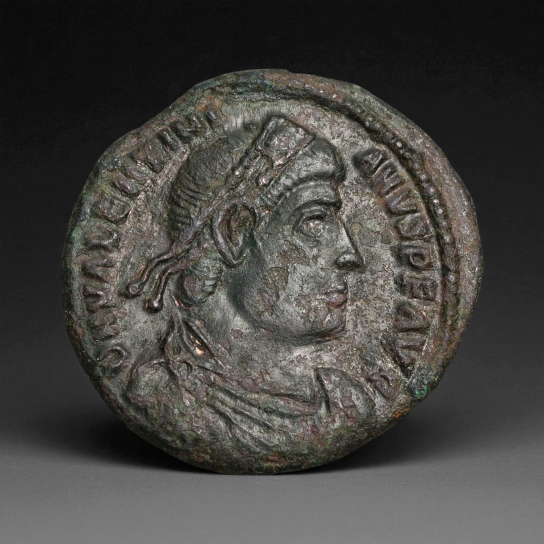 ROMAN EMPIRE: Imperial Authority - Bronze Coin, c. 1st-3rd Century AD, 19mm: Struck during the turbulent decades of the later Roman Empire, this 19mm bronze coin reflects the enduring symbolism of imperial control amidst crisis. Its compact yet deliberate design likely feature
